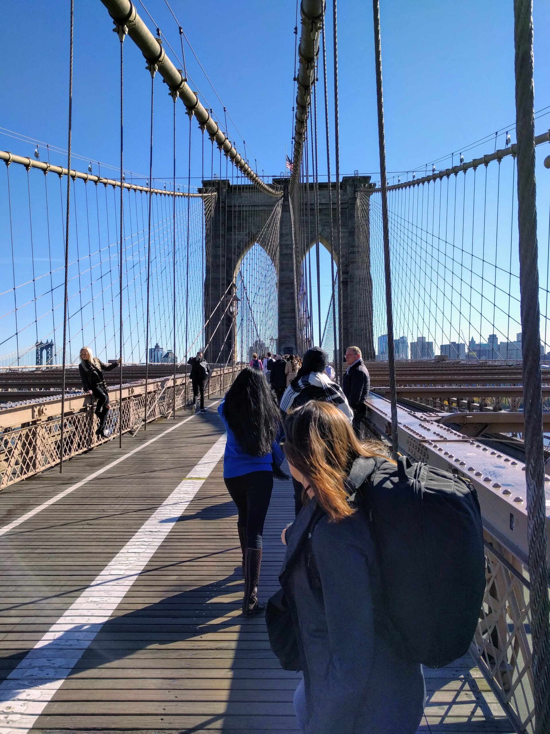 Walking across the Brooklyn Bridge with our MEC Shuttle II bags