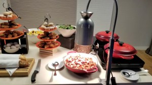 Food at the complimentary continental breakfast: potatoes, oatmeal, salad, fruit salad, and pastries
