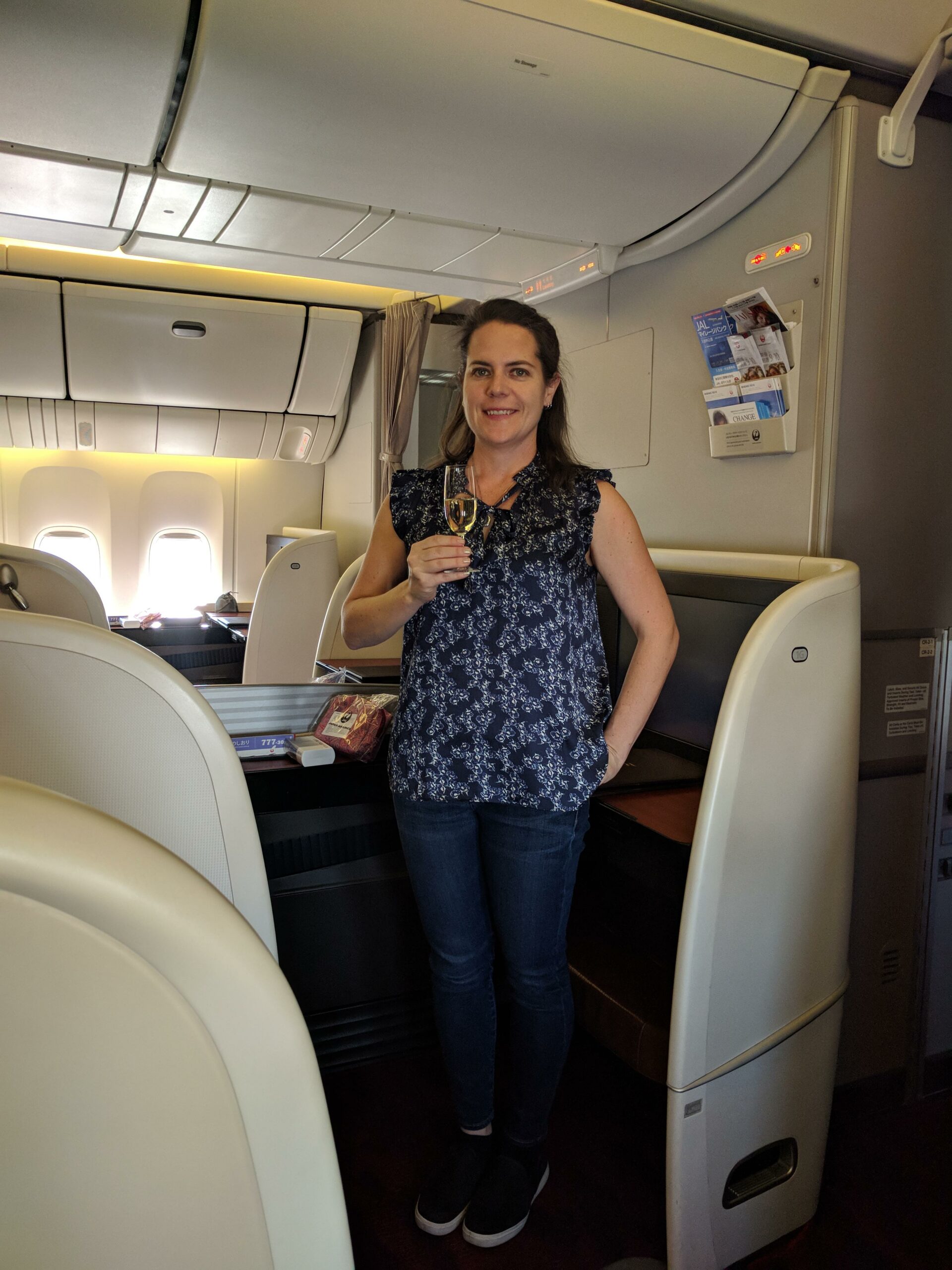 Max anjoying Salon 2007 champagne in Japan Airlines First Class