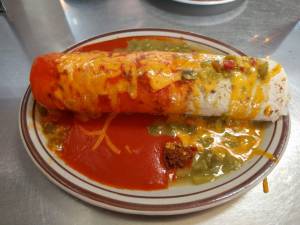 Breakfast burrito with red and green chile sauce and chorizo at Duran Central Pharmacy in Albuquerque