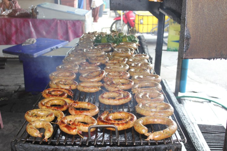 Sai ua grilling at the Mae Hia Market