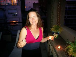 Poetry Building: Terrace Suite 5A: Max on the upper patio lighting a candle
