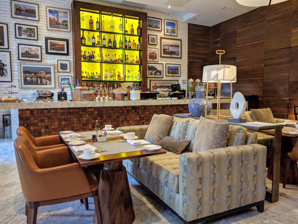 Breakfast area in the morning and bar at night