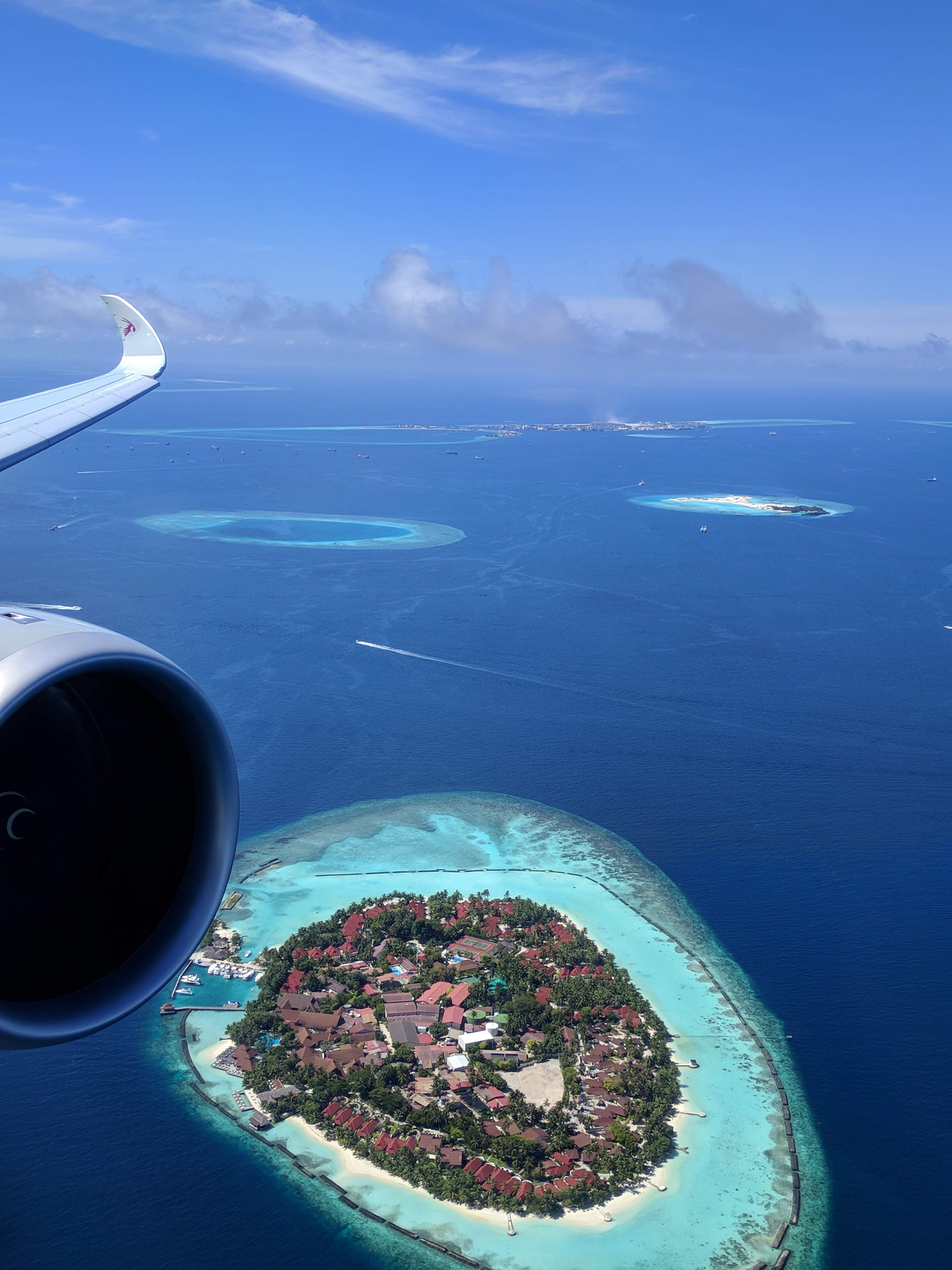 View from the wing on the Qatar A350-1000 over the Maldives