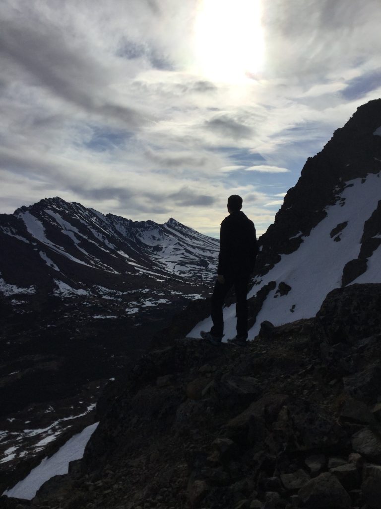 Jason enjoying the view while hiking up Flattop Mountain