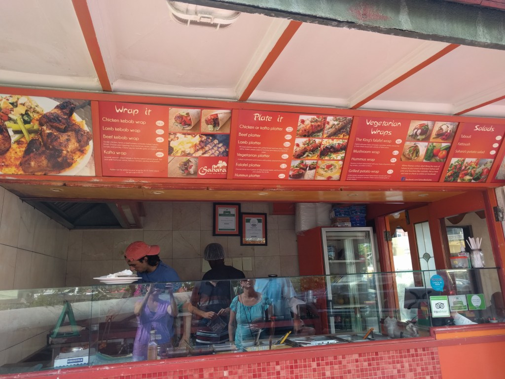 Menu and food counter at Sahara Arabic Grill and Falafel