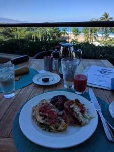 Veggie egg white omelette, hashbrowns, loco moco, guava juice, and brownie from the buffet at 'Ikena Landing