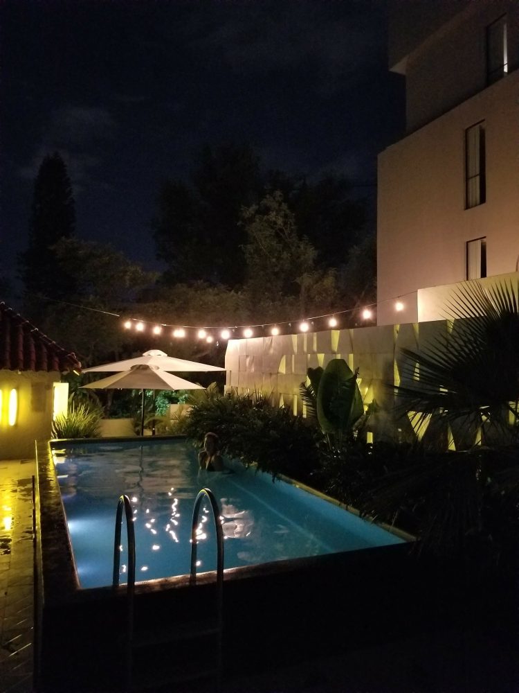 Max in the pool at night at Casa Habita in Guadalajara