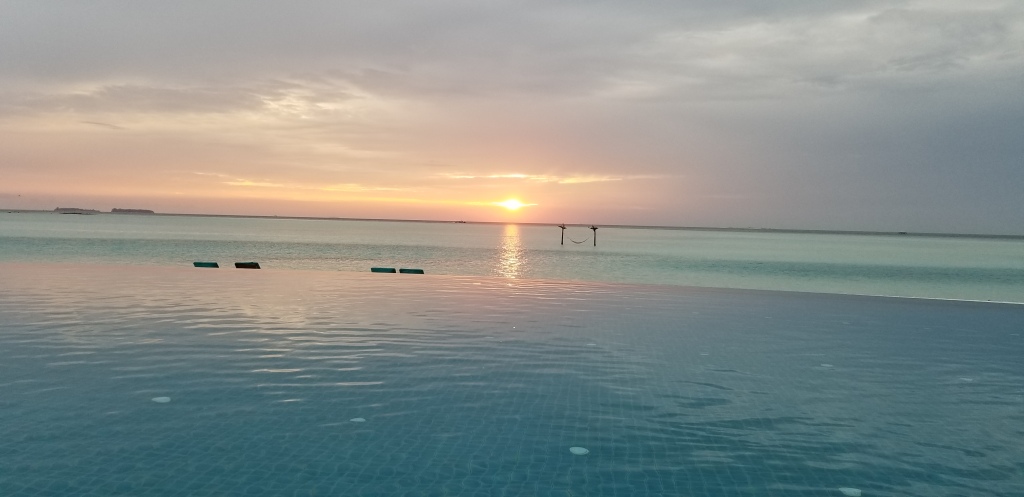 Sunset from the infinity pool at the Anantara Dhigu