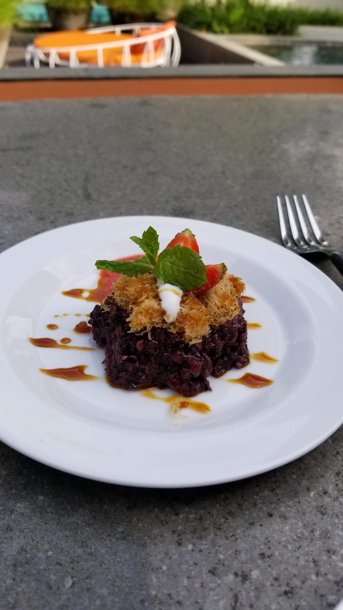 Black rice dessert served at tea time