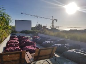 The Slow - Outdoor movie night on the rooftop