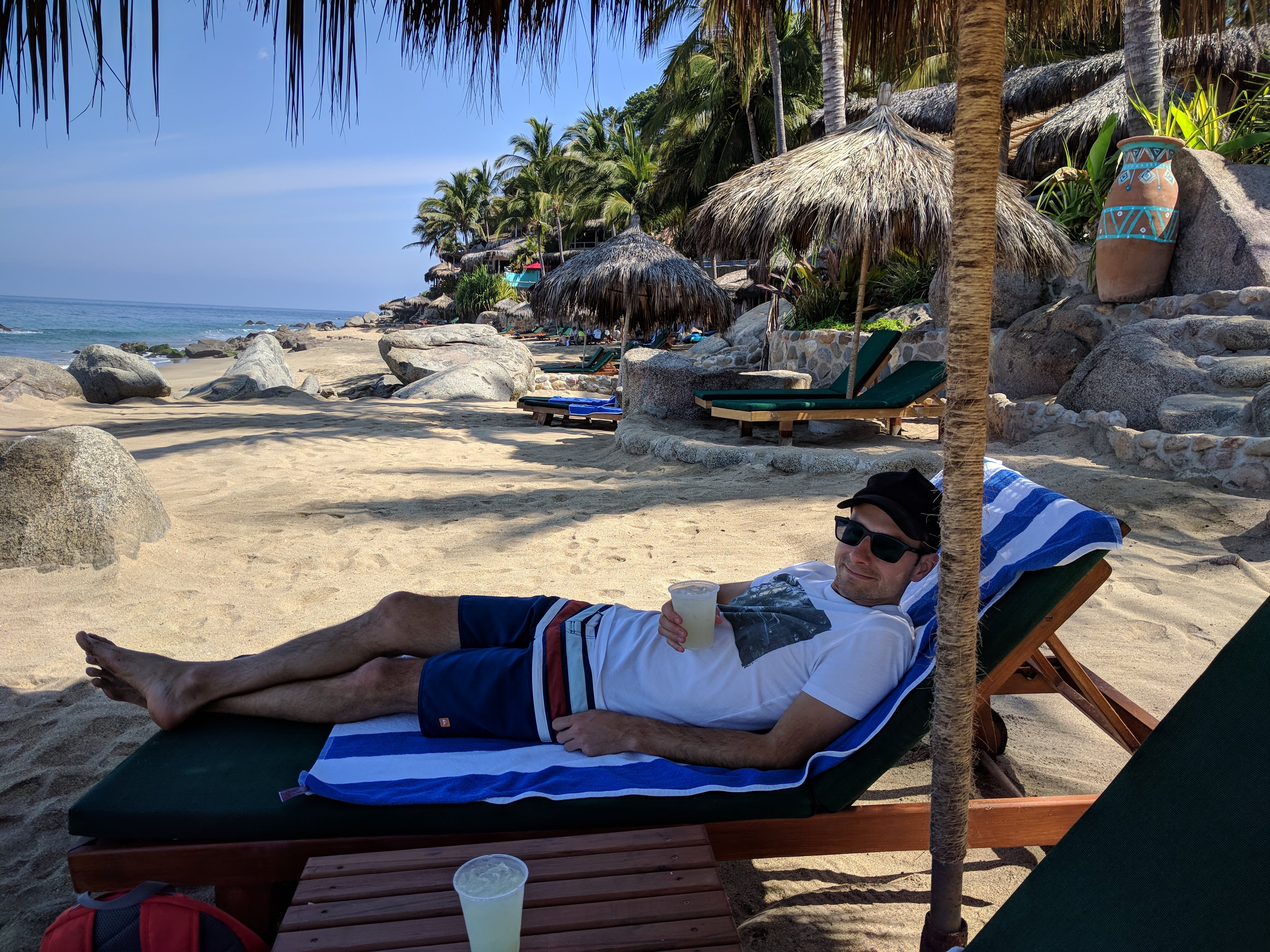 Jason with the welcome margarita on the beach