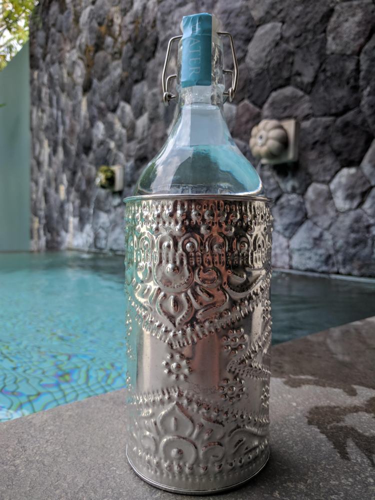 Glass bottle refilled with water at The Purist Villas in Ubud