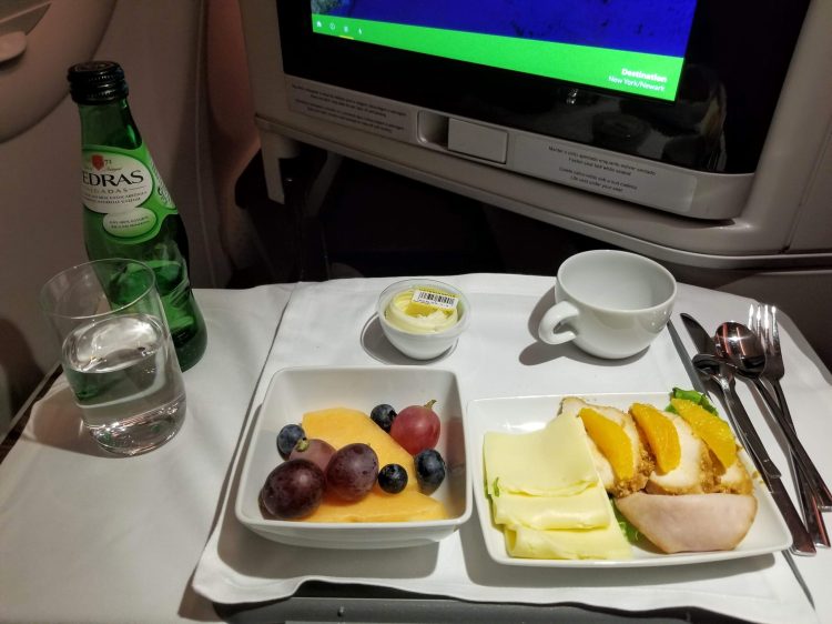 TAP Air Portugal's A330neo from LIS to EWR: arrival meal of fruit and a plate of cold cuts and cheese
