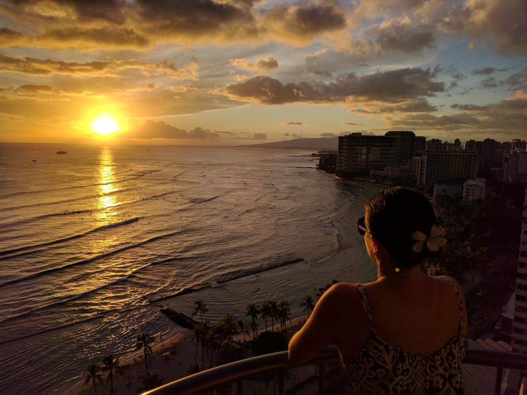 Max watching the sunset from our balcony at the Waikiki Marriott