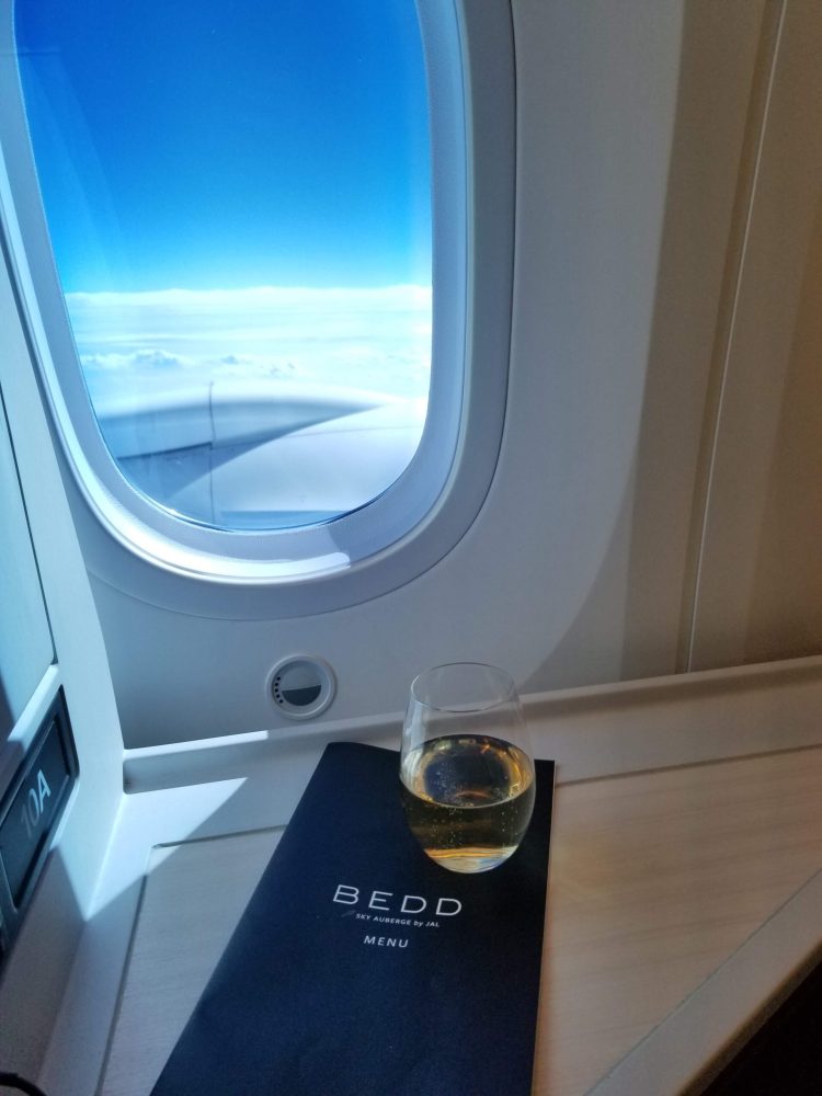 Champagne at 40,000 feet in JAL Business Class on the 787-900 Sky Suite III