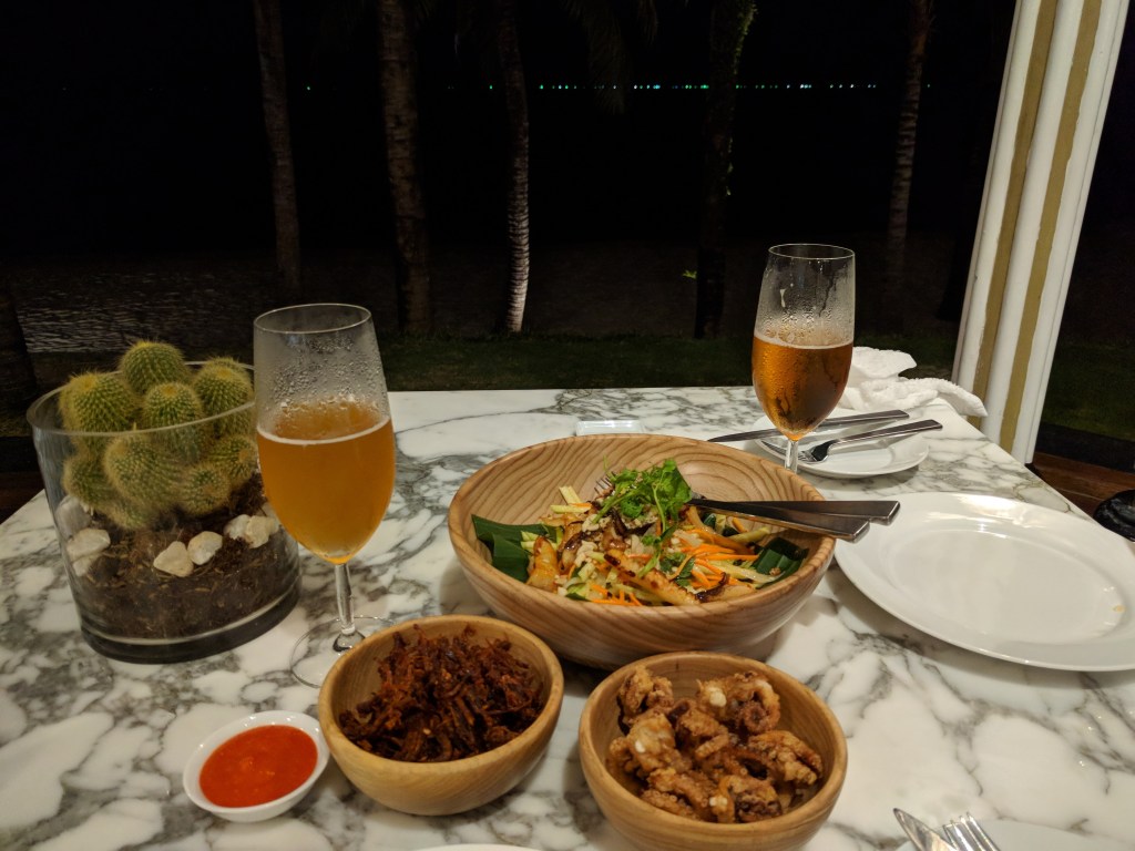 JW Marriott Phu Quoc Resort at Emerald Bay - Dinner at the resort: squid, seafood mango salad, and spicy beef jerky with Pasteur Brewing craft beer