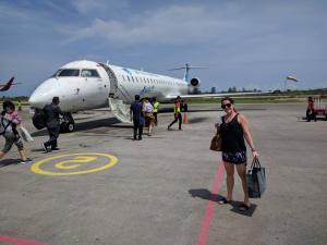 Max at Tambolaka Airport in front of a Garuda Indonesia CRJ