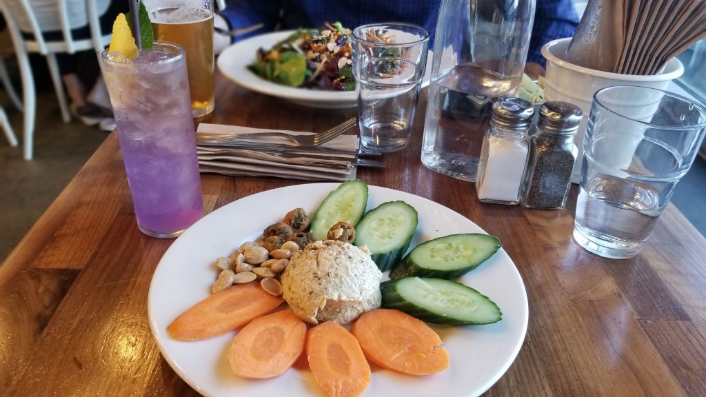 Hummus plate without pita and Purple Rain cocktail