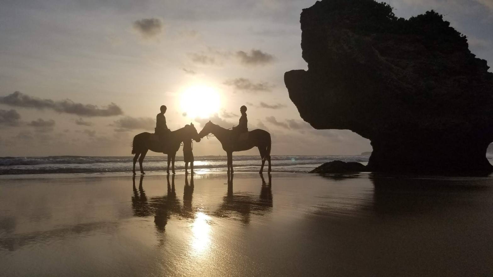 Sunset horse ride on the beach