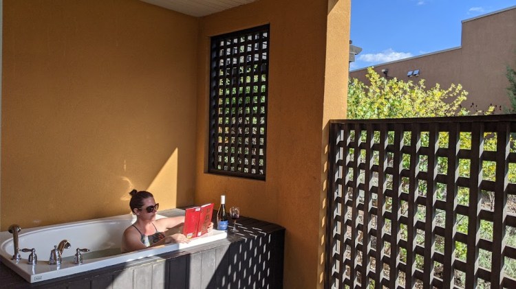 Max enjoying the outdoor bath in a One-Bedroom Corner Condo with King Bed (plus pullout bed) at Spirit Ridge Resort in Osoyoos