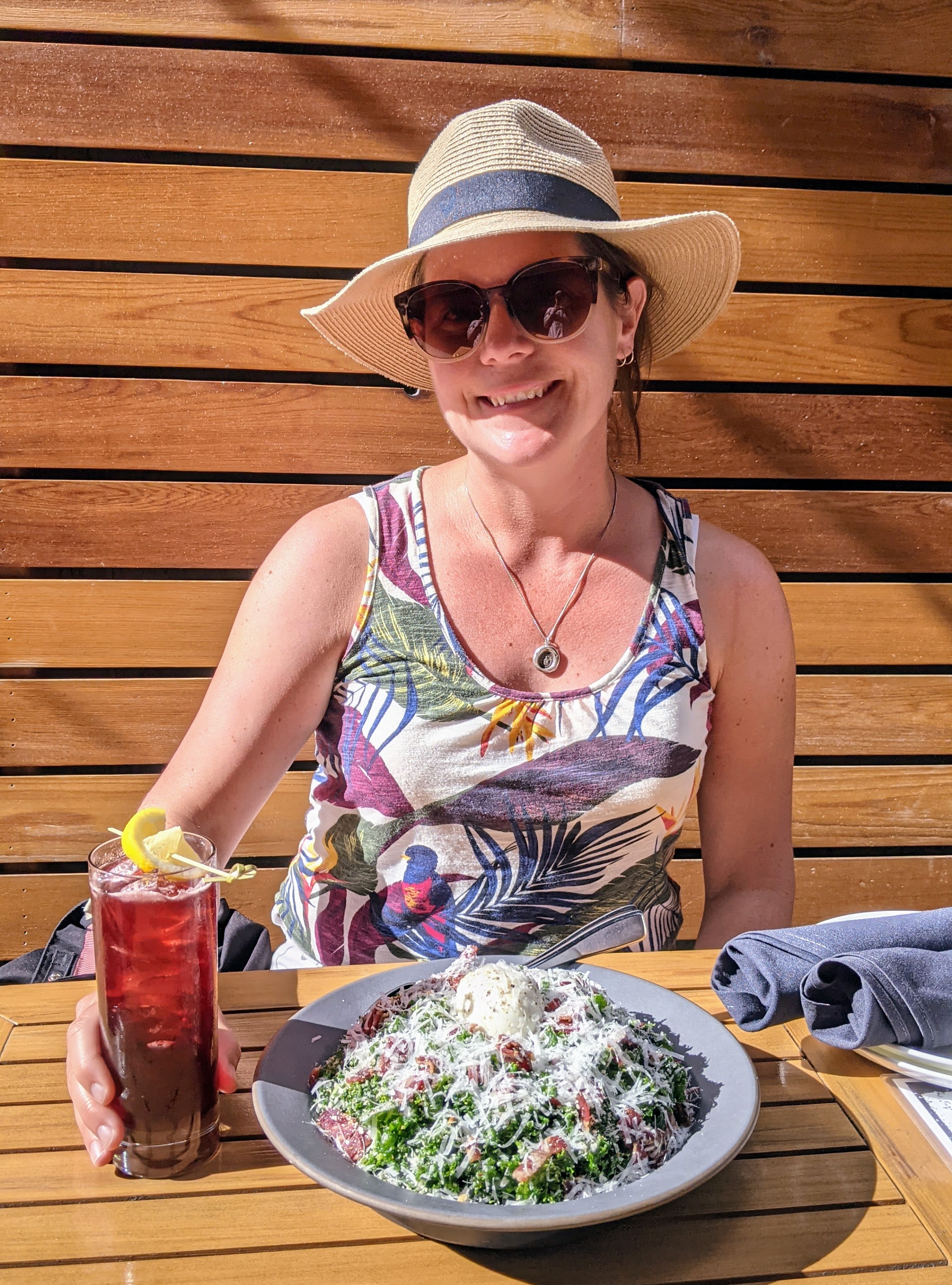 Max enjoying a cocktail and kale caesar salad at Una