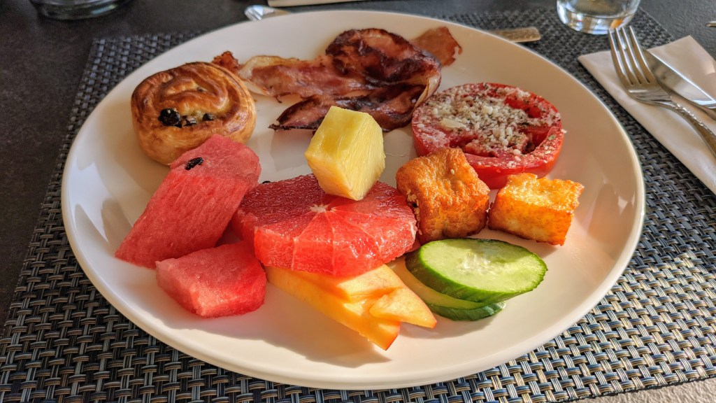 Aegon Mykonos: Some of the items from the breakfast buffet; fruit, veggies, pastry, honey sesame halloumi, bacon