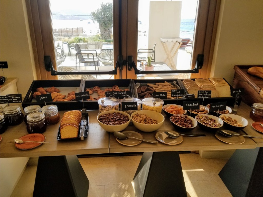 Aegon Mykonos: Breakfast buffet options like breads, pastries and cereal