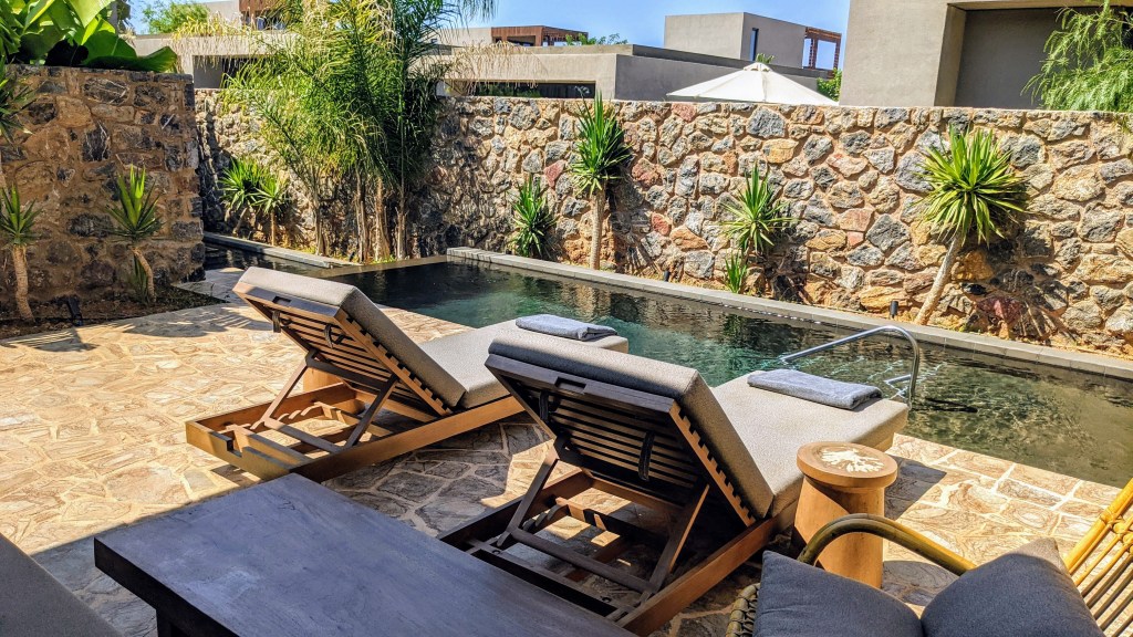 Tropical Open Plan Suite with shared pool: outdoor seating and pool