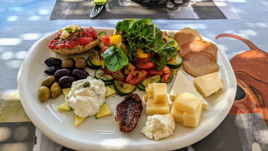 Vioma Organic Farm and Vineyard: Our meze plate with dakos, a salad, local cured meat, a selection of local cheese, olives and their amazing tzatziki