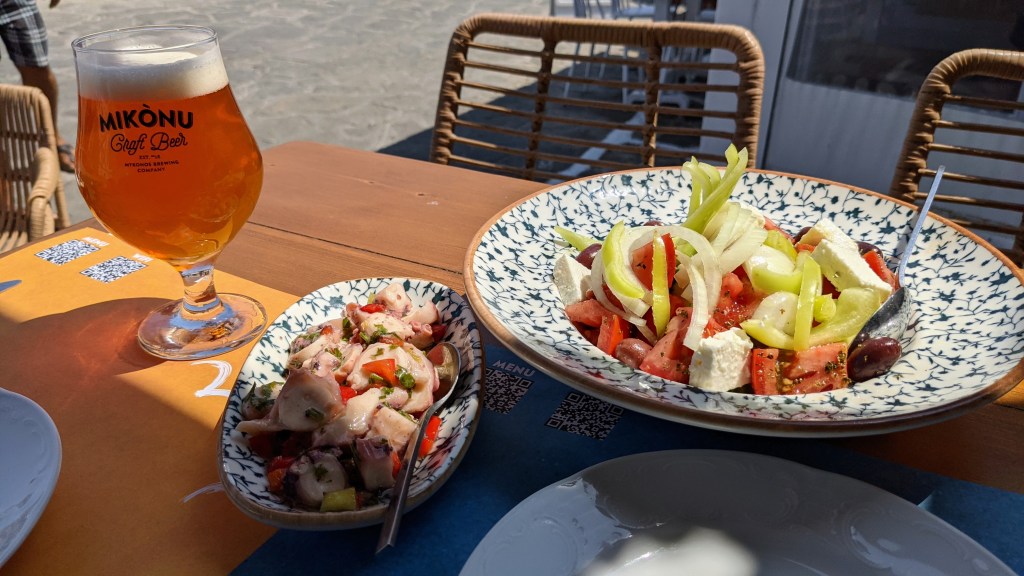 Captain's: Mykonos craft beer draft, pickled octopus, and Greek salad