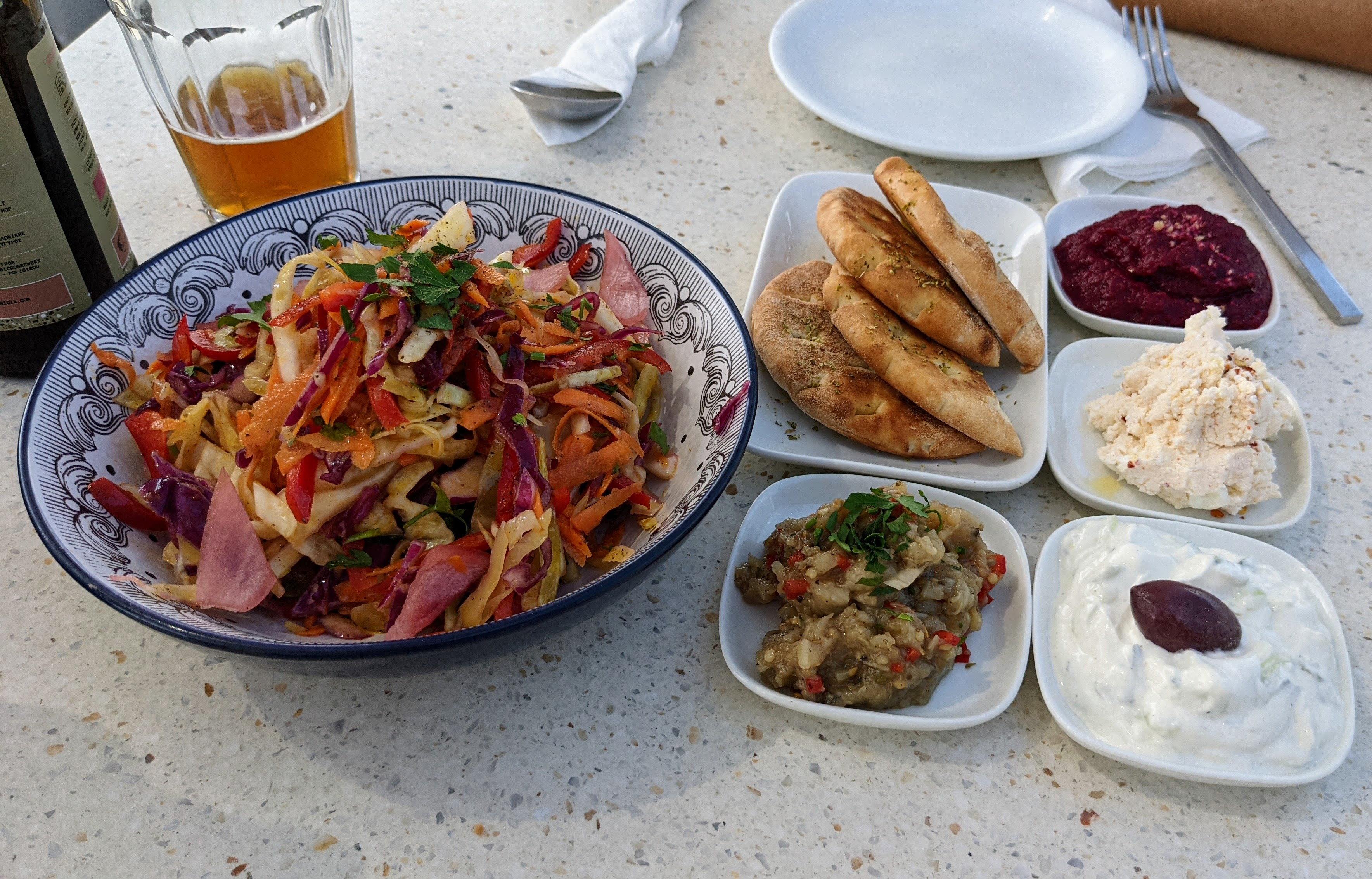 Salad and assorted dips at Melitini in Oia