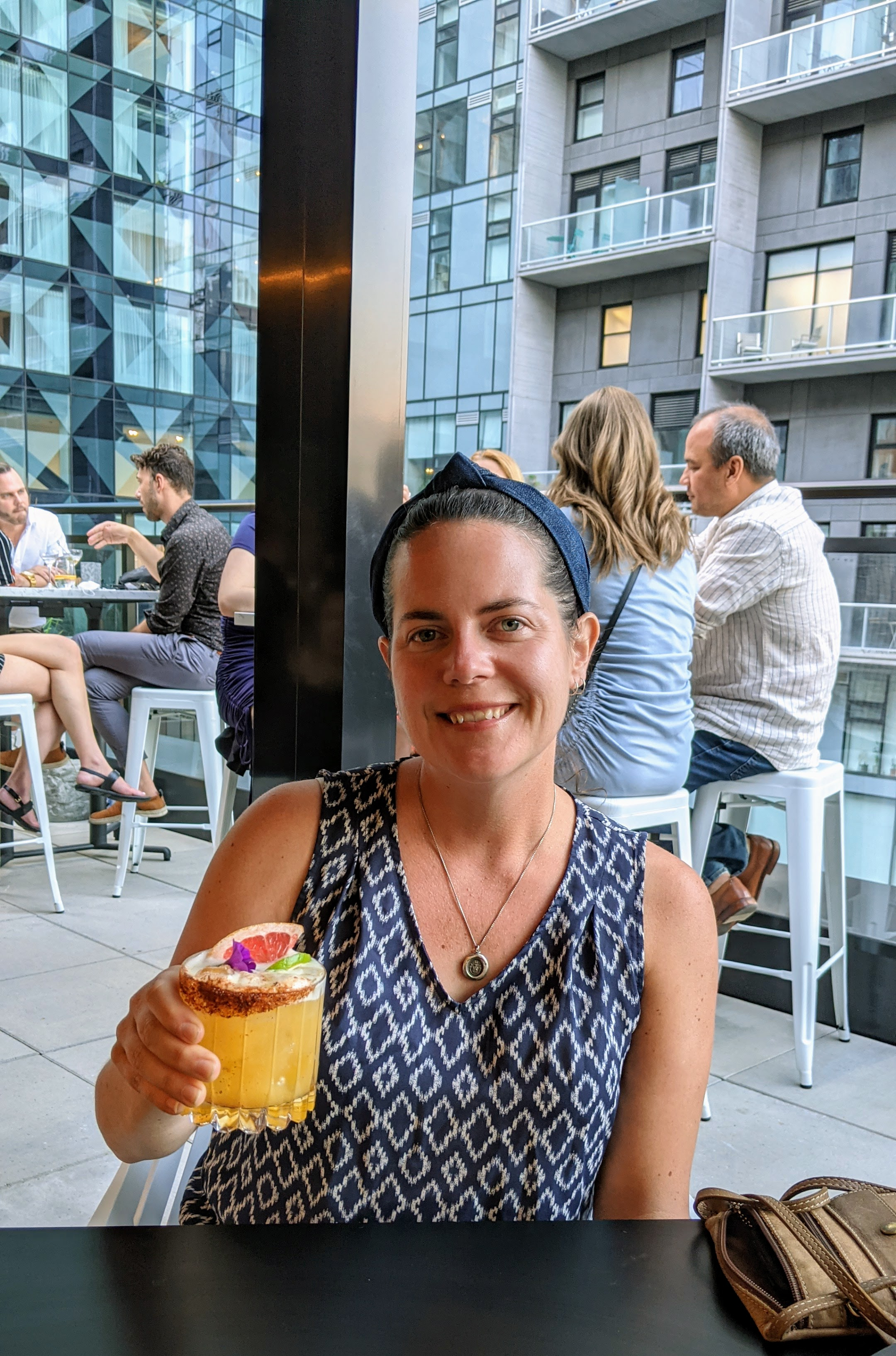 Max enjoying a cocktail at the rooftop bar
