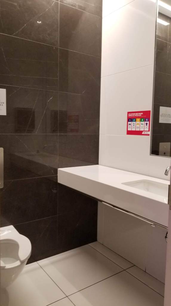 YUL - Montreal National Bank VIP Lounge: bathroom/enclosed stall (bad photo)